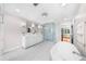 This primary bathroom boasts a soaking tub, and a double sink vanity and a glass shower at 4635 High Point Rd, Atlanta, GA 30342