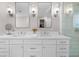 This bathroom vanity features double sinks, modern lighting, and ample storage at 4635 High Point Rd, Atlanta, GA 30342