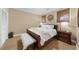 Relaxing bedroom with natural light, a wooden bed frame, bedside tables and storage at 4635 High Point Rd, Atlanta, GA 30342