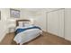 Cozy bedroom features neutral walls, plush carpet, woven headboard and ample closet space at 4635 High Point Rd, Atlanta, GA 30342