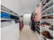 Walk-in closet featuring built-in shelving and hanging racks for optimal storage at 4635 High Point Rd, Atlanta, GA 30342