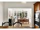 The dining room offers an eating area that opens out to the back porch through a wall of windows at 4635 High Point Rd, Atlanta, GA 30342