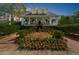 Charming two-story home with a inviting front porch, beautiful landscaping, and classic architectural details at 4635 High Point Rd, Atlanta, GA 30342