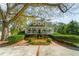 Stunning home exterior with a welcoming front porch, brick pathway, and lush landscaping creating an inviting curb appeal at 4635 High Point Rd, Atlanta, GA 30342