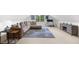 Loft area features a sectional, tv, desk and a neutral color pallet at 4635 High Point Rd, Atlanta, GA 30342