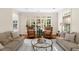 Bright living room with large windows, plush sofas, and comfortable seating at 4635 High Point Rd, Atlanta, GA 30342