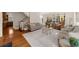 Bright living room with large windows, plush sofas, and comfortable seating and hardwood floors at 4635 High Point Rd, Atlanta, GA 30342