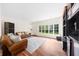 The living room features hardwood floors, a large windows, and a bar at 4635 High Point Rd, Atlanta, GA 30342