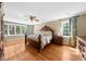 Bright and airy main bedroom with hardwood floors, large windows, and elegant decor, creating a relaxing retreat at 4635 High Point Rd, Atlanta, GA 30342