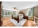 Bright and airy main bedroom with hardwood floors, large windows, and elegant decor, creating a relaxing retreat at 4635 High Point Rd, Atlanta, GA 30342