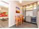 Entertaining wet bar with illuminated glass shelving, wine fridge, sink and bar seating at 570 Glengate Cv, Atlanta, GA 30328