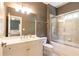 Bathroom with a shower over the bathtub, neutral color, and a white vanity at 570 Glengate Cv, Atlanta, GA 30328