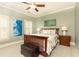 Bedroom with two windows with shutters, neutral color walls, a bed, and two bedside tables at 570 Glengate Cv, Atlanta, GA 30328