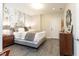 Stylish bedroom with patterned accent wall, neutral bedding, and ample natural light at 570 Glengate Cv, Atlanta, GA 30328