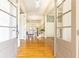 Inviting foyer with hardwood floors, elegant staircase, and views into the living spaces at 570 Glengate Cv, Atlanta, GA 30328