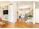 Open home floor plan showing foyer, stairs, and living room with white trim and hardwood floors at 570 Glengate Cv, Atlanta, GA 30328