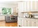 Modern kitchen featuring custom cabinets, stainless steel appliances, and granite countertops at 570 Glengate Cv, Atlanta, GA 30328