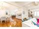Living area opens to kitchen and dining room with hardwood floors, and large windows for natural light at 570 Glengate Cv, Atlanta, GA 30328