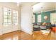 Inviting living area with hardwood floors seen through the house's French doors at 570 Glengate Cv, Atlanta, GA 30328