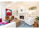 Bright living room features a fireplace, built-in shelving, and French doors to the outside at 570 Glengate Cv, Atlanta, GA 30328