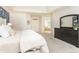 Spacious main bedroom leading to the ensuite bathroom, with natural light and detailed design at 570 Glengate Cv, Atlanta, GA 30328
