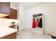Mud room features dark wood desk and white hall tree with coat hooks for convenient storage at 570 Glengate Cv, Atlanta, GA 30328