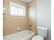 Full bathroom has tub, shower and a window at 7 Villa Se Ct, Smyrna, GA 30080