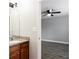 Bathroom view featuring a granite vanity and view to the hardwood floors in bedroom at 7 Villa Se Ct, Smyrna, GA 30080