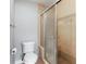 The toilet and glass shower enclosure are features in the bathroom at 7 Villa Se Ct, Smyrna, GA 30080