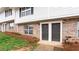 Charming brick and shingle townhome featuring individual front doors and well-maintained landscaping at 7 Villa Se Ct, Smyrna, GA 30080