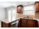Updated kitchen featuring granite counters, stainless appliances, and convenient double sink setup at 7 Villa Se Ct, Smyrna, GA 30080