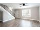 Bright living area with staircase, modern laminate floors, and large windows filling the space at 7 Villa Se Ct, Smyrna, GA 30080