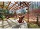 Inviting backyard patio featuring a wood pergola and relaxing hammock swings at 706 Registry Run, Kennesaw, GA 30152
