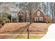 Exterior shot of a two-story brick home with nice curb appeal at 706 Registry Run, Kennesaw, GA 30152