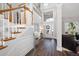 Spacious foyer with hardwood floors, a staircase, and a large window for ample natural light at 706 Registry Run, Kennesaw, GA 30152