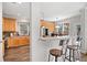 Kitchen area with breakfast bar and wood cabinets, connecting to an eat-in breakfast room at 706 Registry Run, Kennesaw, GA 30152