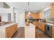 Spacious kitchen with an island, wooden cabinets, and stainless-steel appliances at 706 Registry Run, Kennesaw, GA 30152