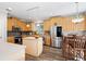 Well-equipped kitchen with stainless steel appliances, wooden cabinets, and an island at 706 Registry Run, Kennesaw, GA 30152