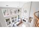 Bright living room with high ceilings, large windows, and a fireplace, with a large, comfy couch at 706 Registry Run, Kennesaw, GA 30152
