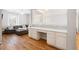 Open-concept living space featuring hardwood floors, lots of natural light and a built-in desk area at 706 Registry Run, Kennesaw, GA 30152