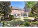 Expansive backyard with patio, well-maintained lawn, and tasteful landscaping for outdoor enjoyment at 825 Glengate Pl, Atlanta, GA 30328
