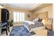 Well-lit bedroom with a desk, bed, and window, offering a comfortable and functional living space at 825 Glengate Pl, Atlanta, GA 30328