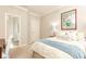 Inviting bedroom with a comfortable bed, doorway leading to a bathroom, and cozy decor at 825 Glengate Pl, Atlanta, GA 30328