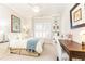 Comfortable bedroom with a bed, a bright window with shutters, built-in bookshelf, and a workspace at 825 Glengate Pl, Atlanta, GA 30328