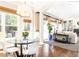 Bright dining room and living room, featuring large windows, and seamless transitions to the kitchen at 825 Glengate Pl, Atlanta, GA 30328