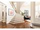 Bright foyer with hardwood floors, staircase, and architectural details, with natural light at 825 Glengate Pl, Atlanta, GA 30328