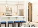 Well-lit kitchen with stainless steel appliances, a breakfast bar, and modern pendant lighting at 825 Glengate Pl, Atlanta, GA 30328