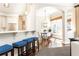 Sunlit kitchen and breakfast area, with a breakfast bar, seamlessly connected to the living room at 825 Glengate Pl, Atlanta, GA 30328