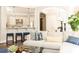 Well-appointed kitchen visible from living room, featuring a breakfast bar with seating and pendant lighting at 825 Glengate Pl, Atlanta, GA 30328