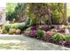 Manicured landscaping showcases colorful flowers and shrubs, enhancing the natural beauty of the yard at 825 Glengate Pl, Atlanta, GA 30328